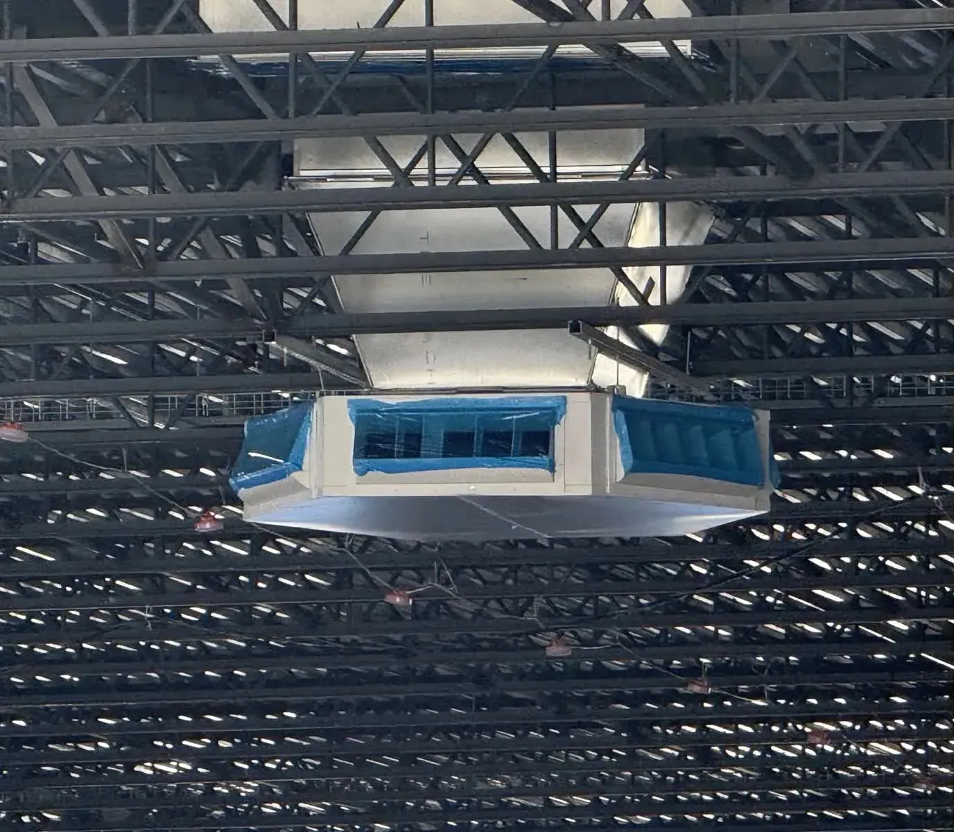 Air handling unit suspended in the structural steel of a distribution facility